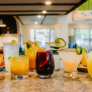 a variety of cocktails on a table