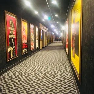 Halls of the theater, decorated w/ old movie posters. Honestly my fave part of the Place :)