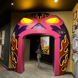 a woman walking through the entrance