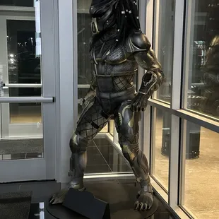 a statue of a predator