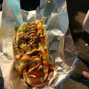 Kosher Hot Dog Wrapped in Bacon with all the fixins