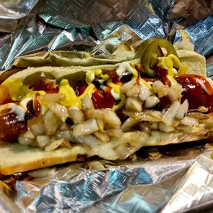 a hot dog covered in condiments