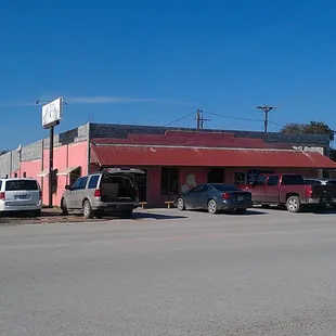 Alamo Restaurant, the Pink Restaurant, next door to a bakery.
