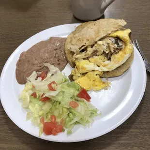 a plate of food and a cup of coffee