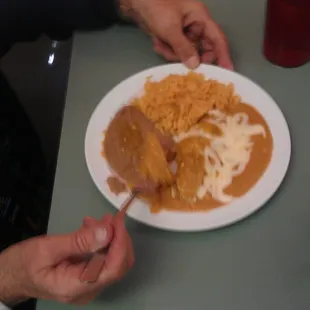 Child&apos;s enchilada plate... Good, but orderer wished she had gotten the chicken taco instead.