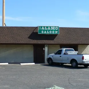 two trucks parked in front of the building
