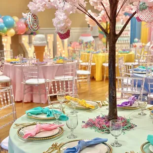 The venue provides round tables and banquet chairs. We supplied  the clear chiavari chairs and decor.