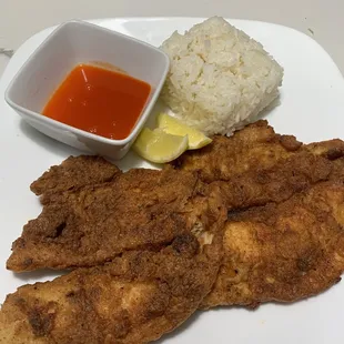 Fried tilapia with a side of white rice