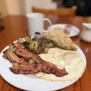 Alana's Combo.   Crispy bacon eggs and potatoes.  With a scone that's out of this world!