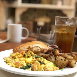 Excellent Alaskan scramble (3 eggs, smoked salmon, spinach &amp; cream cheese) home fries &amp; peach-orange scone!