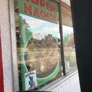 a window with a sign that says super nacho