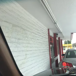 a car parked in front of a restaurant