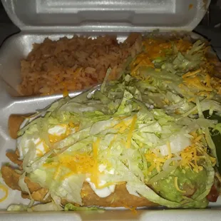 3 rolled tacos with rice and beans