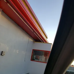 a view of a building from a car window