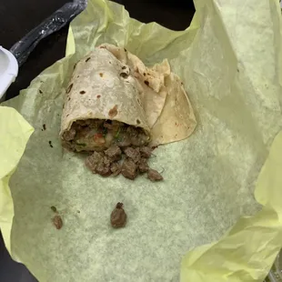 a burrito wrapped in paper