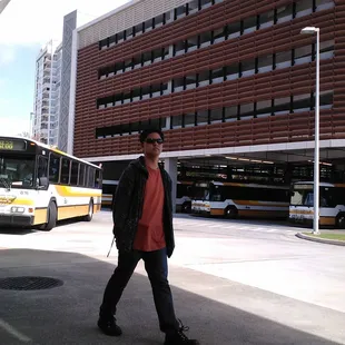 woops, that guy got in the middle of the pic. The busses wait in the huge unloading area of the transit center in the shade.