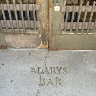 Sign up high and one right there in the cement sidewalk as you walk in.