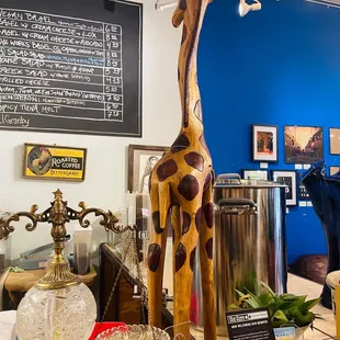 a giraffe statue on display