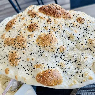 a flat bread with sesame seeds