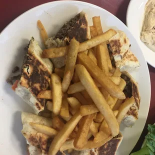 a plate of french fries and a sandwich