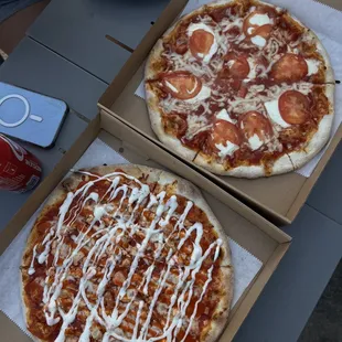 two pizzas with toppings