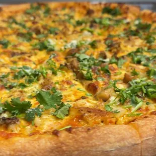 A flavorful buttery tikka sauce made with Tomatoes topped with Tandoori Chicken, Onion, Mozzarella Cheese, Parmesan Cheese, and Cilantro.