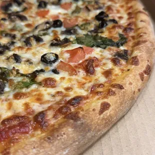 Veggie delights await on our Vegetarian Pizza, specially crafted for plant-based lovers, loaded with a colorful medley of fresh vegetables.