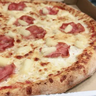 Hawaiian Pizza! A classic favorite that combines the sweetness of juicy pineapple rings with the savory flavor of Canadian bacon.