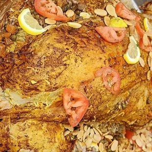 a whole fish with tomatoes and lemons