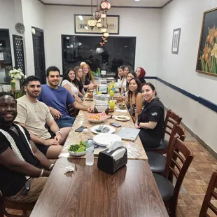 a group of people sitting at a table