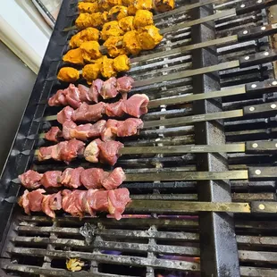the meat being cooked on the grill