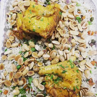 two pieces of chicken and rice