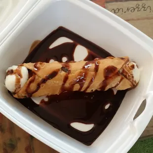 We asked if the cannoil was chocolate diped they said yes and this is what we got a 1.00 extra for some nasty chocolate syurp