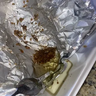 Oil from the fried cheese not only pooled in the container, but seeped all the way through the paper to-go bag. What a mess.
