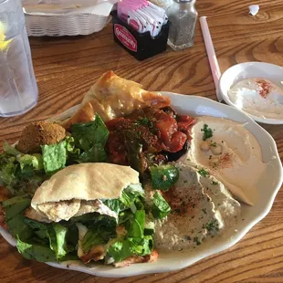 Veggie plate with fatoosh, falafel, babaganush, eggplant musakah, and spanikopita.