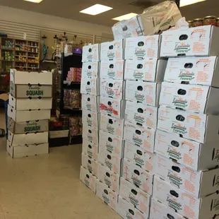 a large stack of boxes in a grocery store