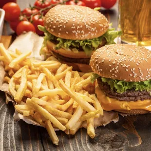 two hamburgers and french fries