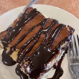 a piece of cake on a plate with a fork