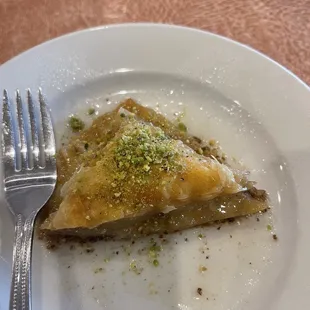 a piece of pie on a plate with a fork