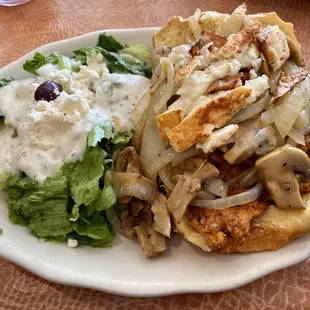 This is the Mediterranean Chicken Burger! It has fried cheese, mushrooms, and onions. Comes with salad or fries.