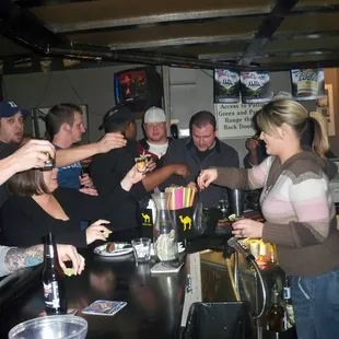 a group of people at a bar