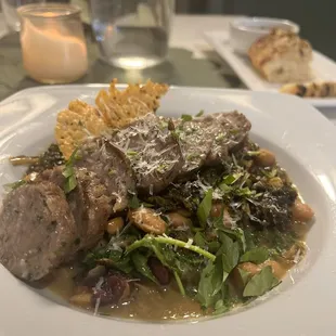 Fancy beans &amp; greens with their own sausage. Rich with deep, delicious flavors!