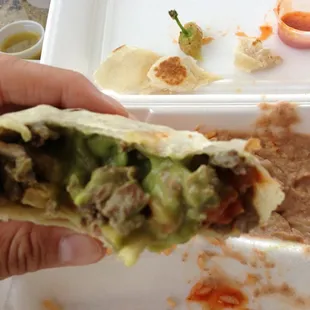 A huge burrito filled with low grade carne guac and onions. Without a doubt you will be full. Full of stomach pains...
