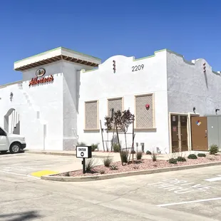 a white building and a white van