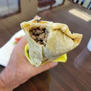 Carne asada burrito, on the dry side and a bit too much of the pico de gallo.
