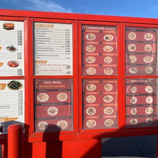 a menu board with a variety of food items
