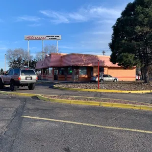 a car parked in front of a restaurant