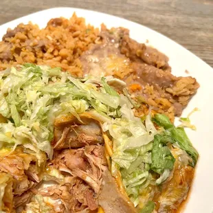 Chicken Enchilada (2) Plate. Section cut to the amazingly juicy and tender chicken! Highly recommend.