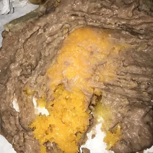 Block of unmelted cheese in the middle of the burrito
