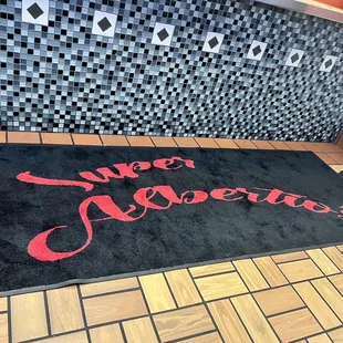 a black and red carpet with the words sweet appetite on it